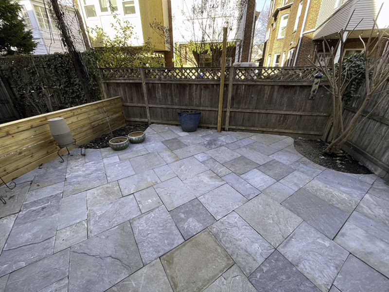 Multi color PA bluestone installed in Cedar Park West Philly backyard - and horizontal cedar fence!